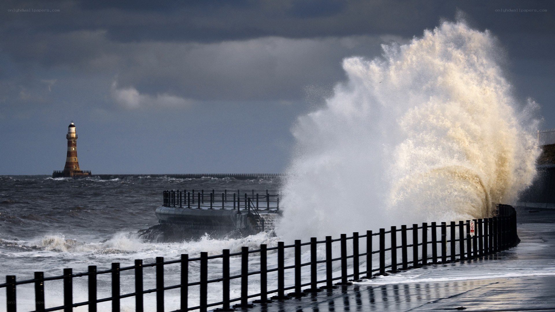 Waves crashing at a lighthouse