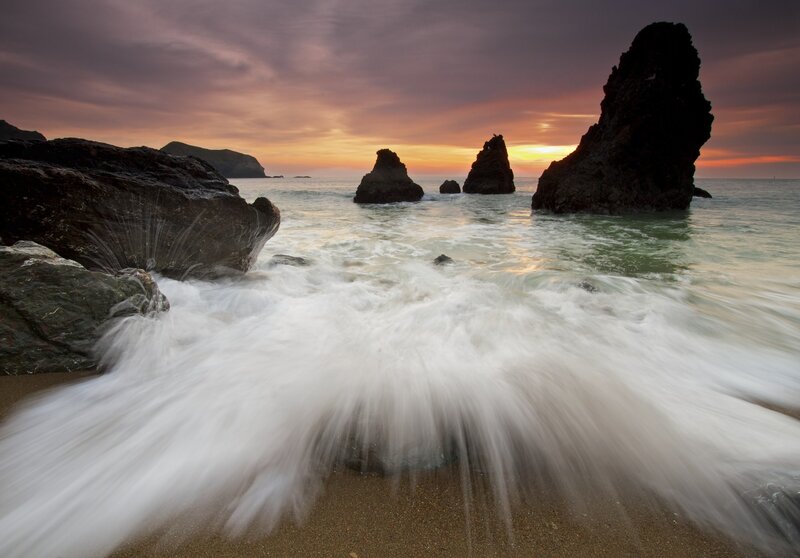 Waves crashing at sunset