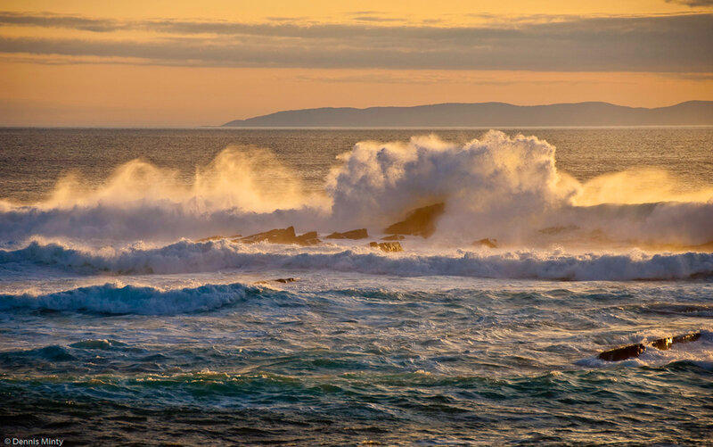 Waves crashing at sunset