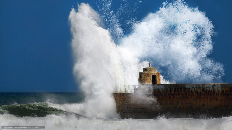 Waves crashing on a lighthouse