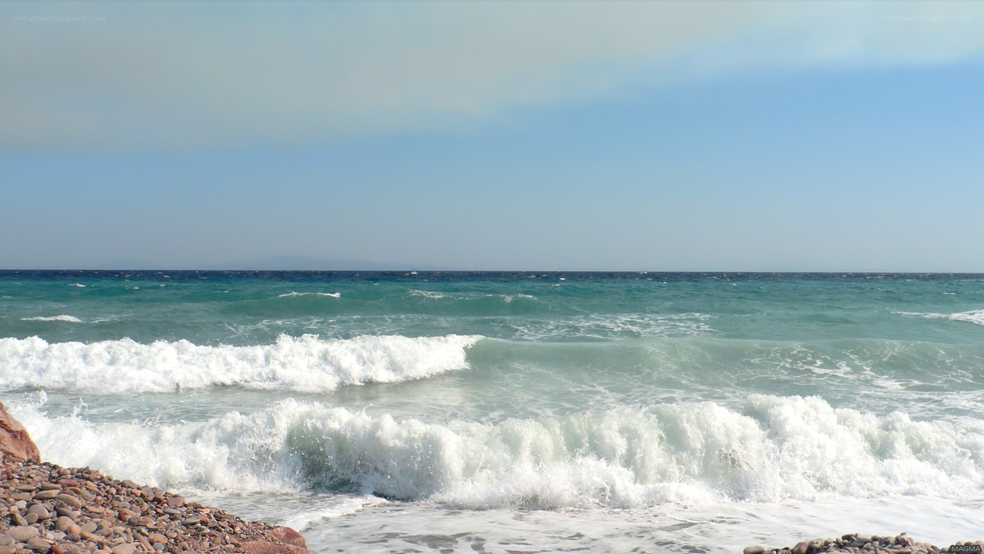 Waves crashing on a pebble beach