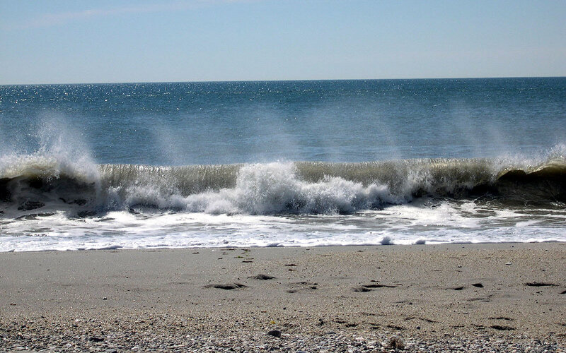 Waves crashing on a pebble beach