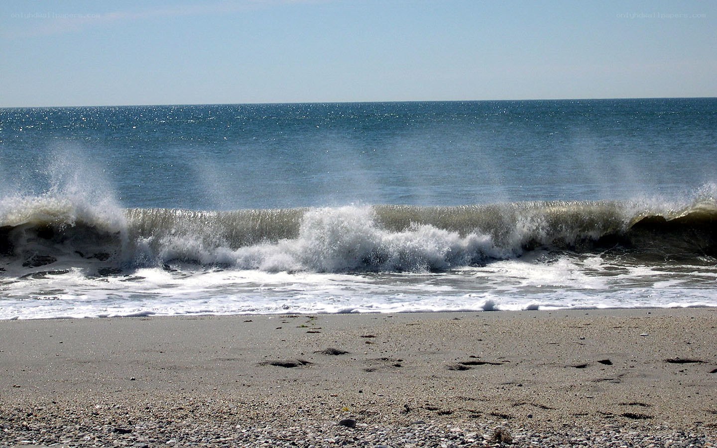 Waves crashing on a pebble beach