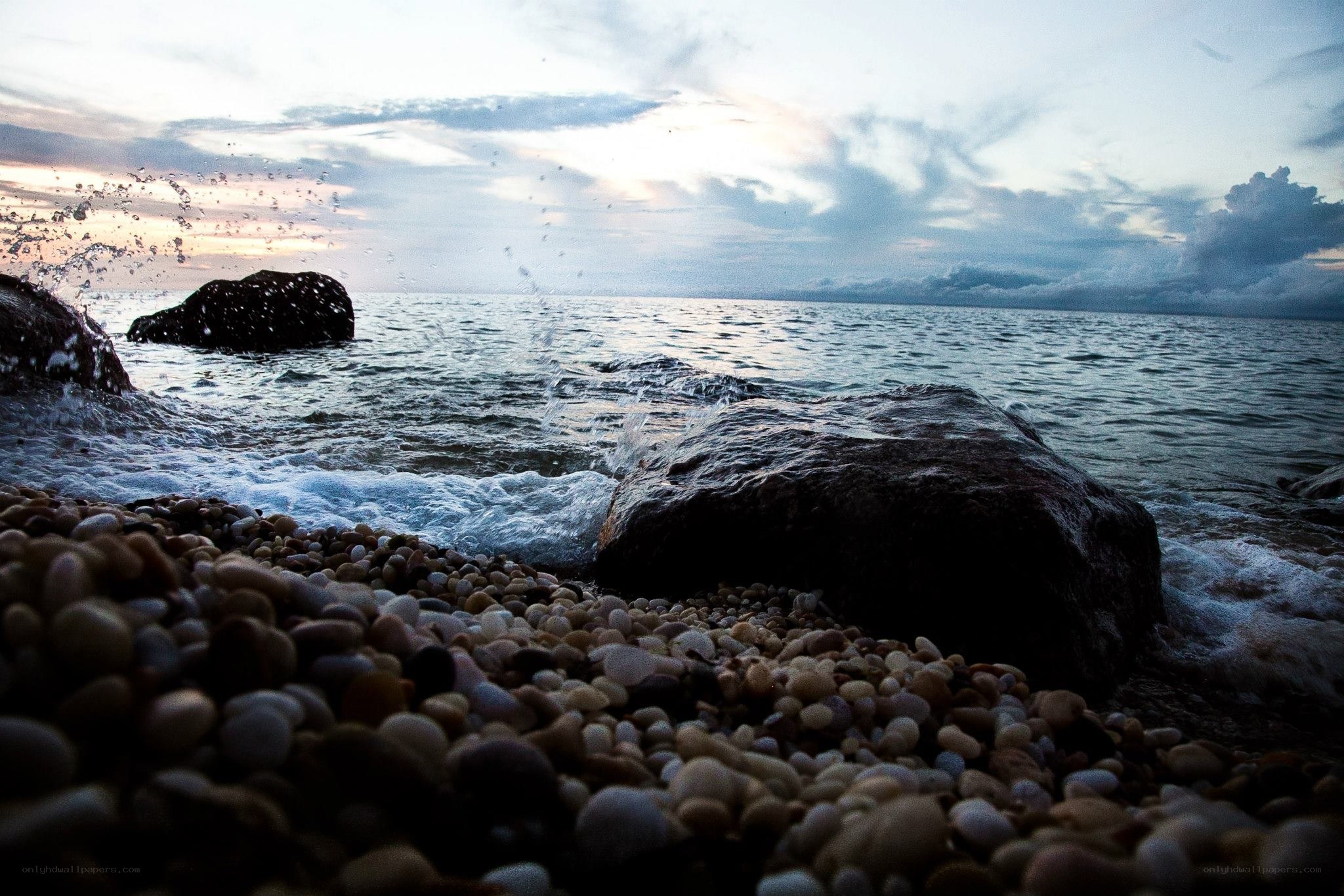 Waves crashing on a pebble beach
