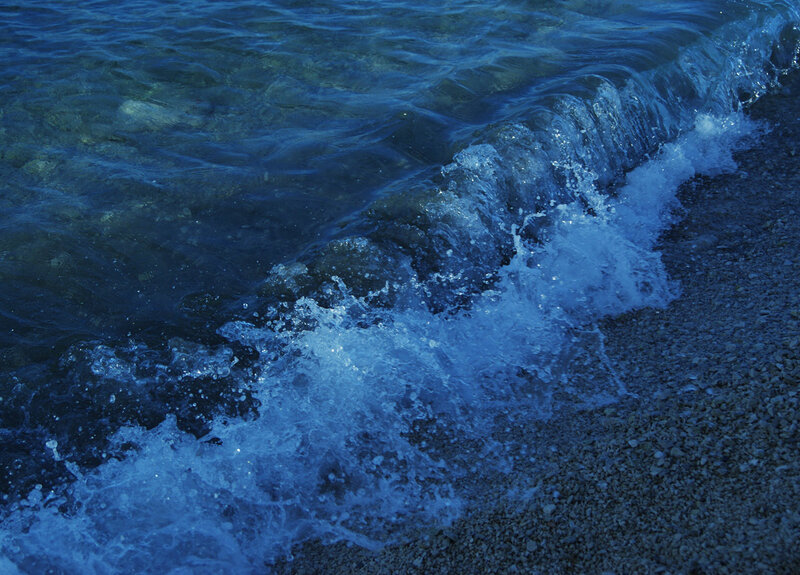 Waves crashing on a pebble shore