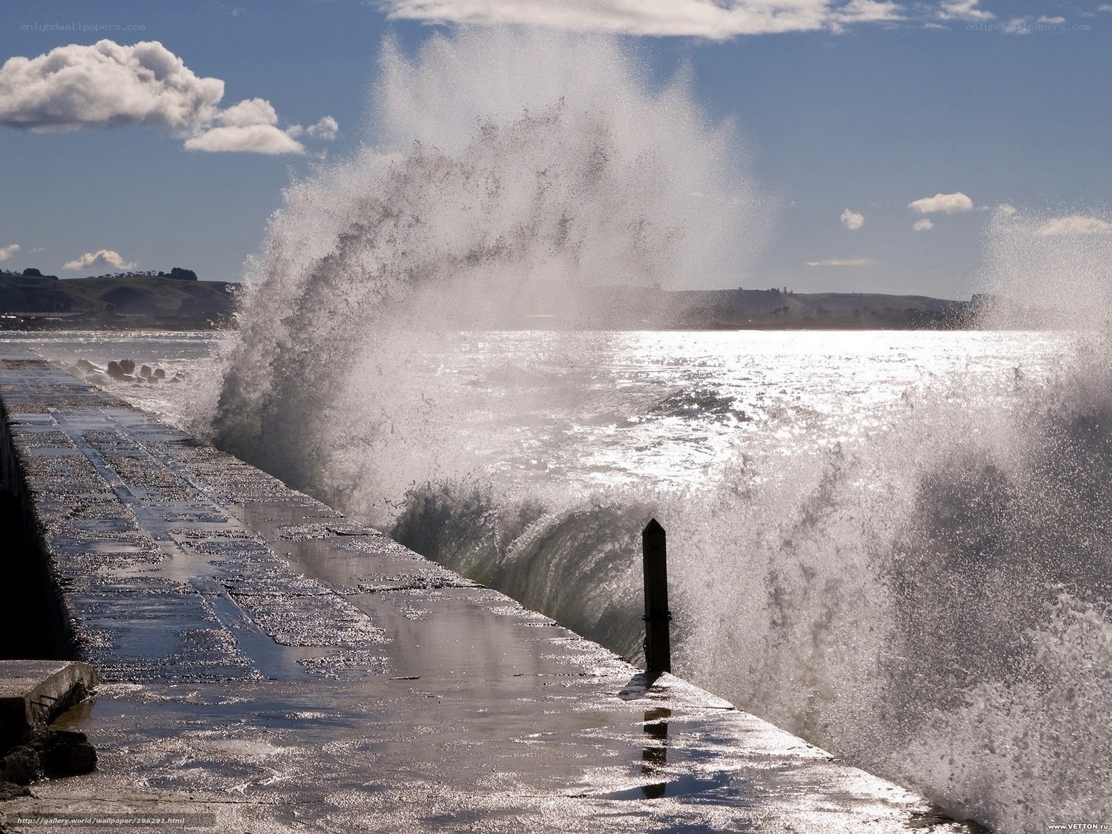 Waves crashing on a pier