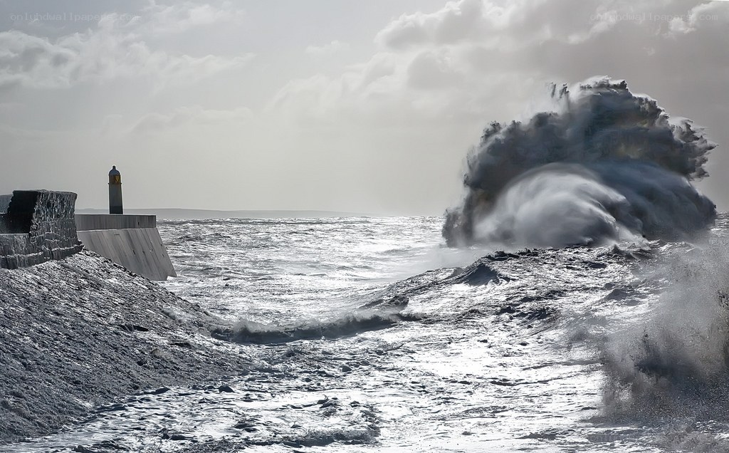Waves crashing on a pier
