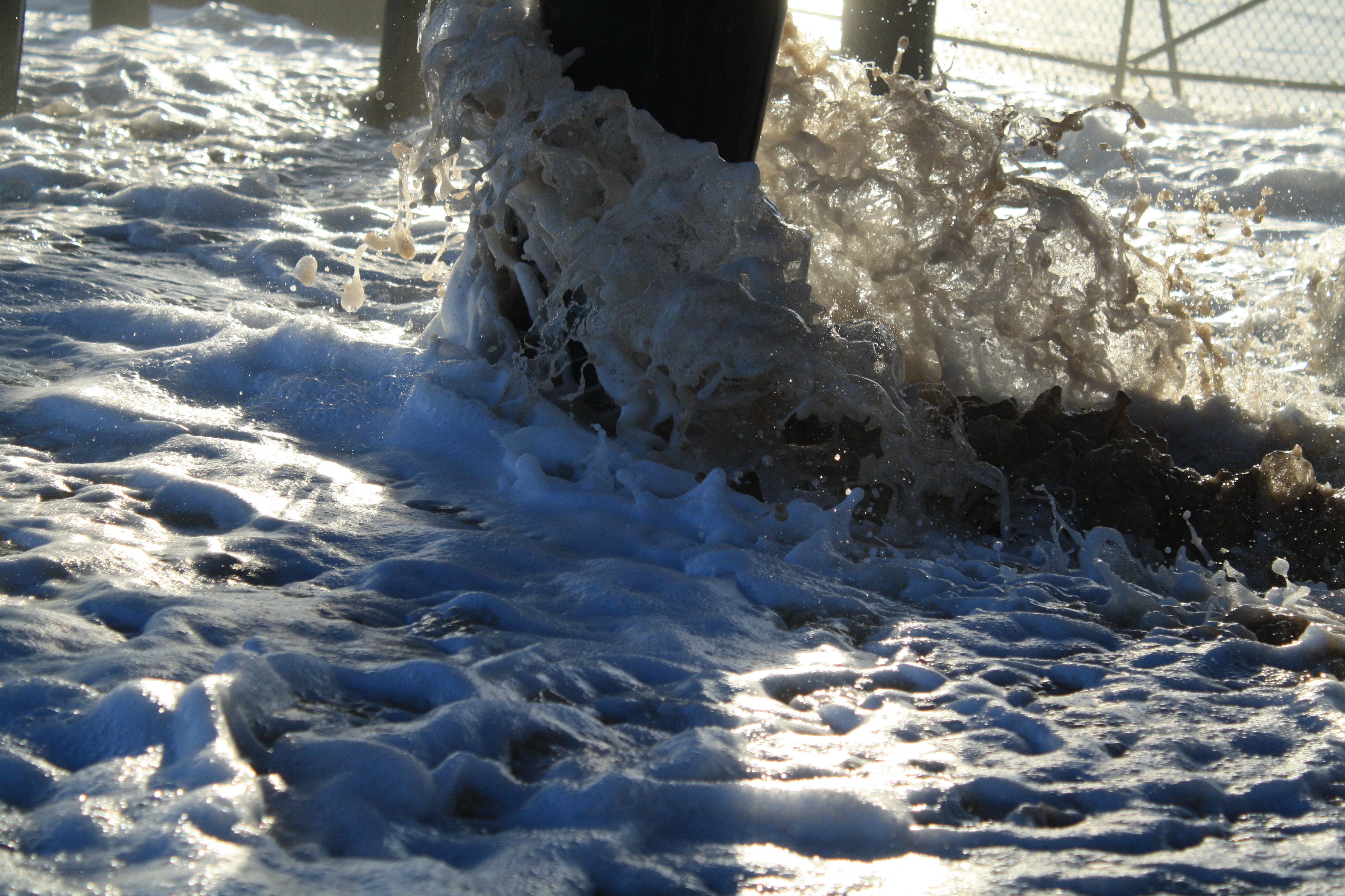 Waves crashing on a pier