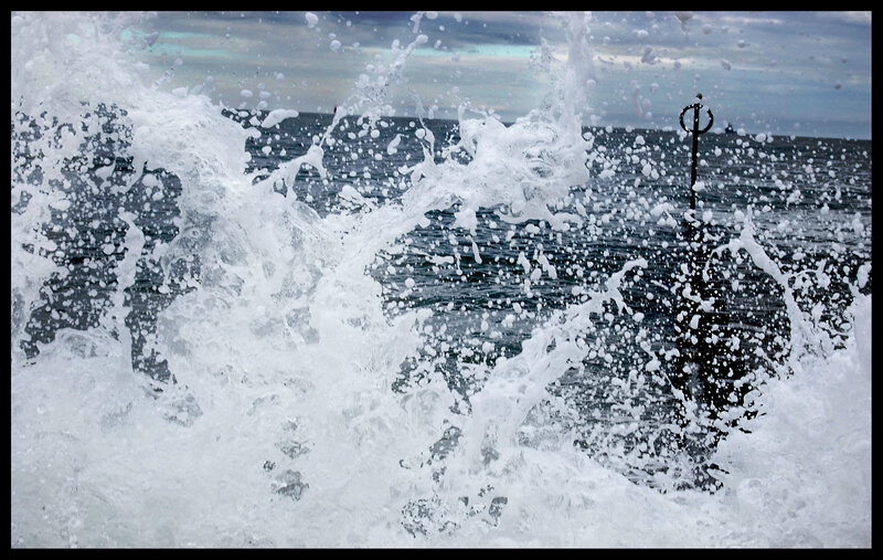 Waves crashing on a pier