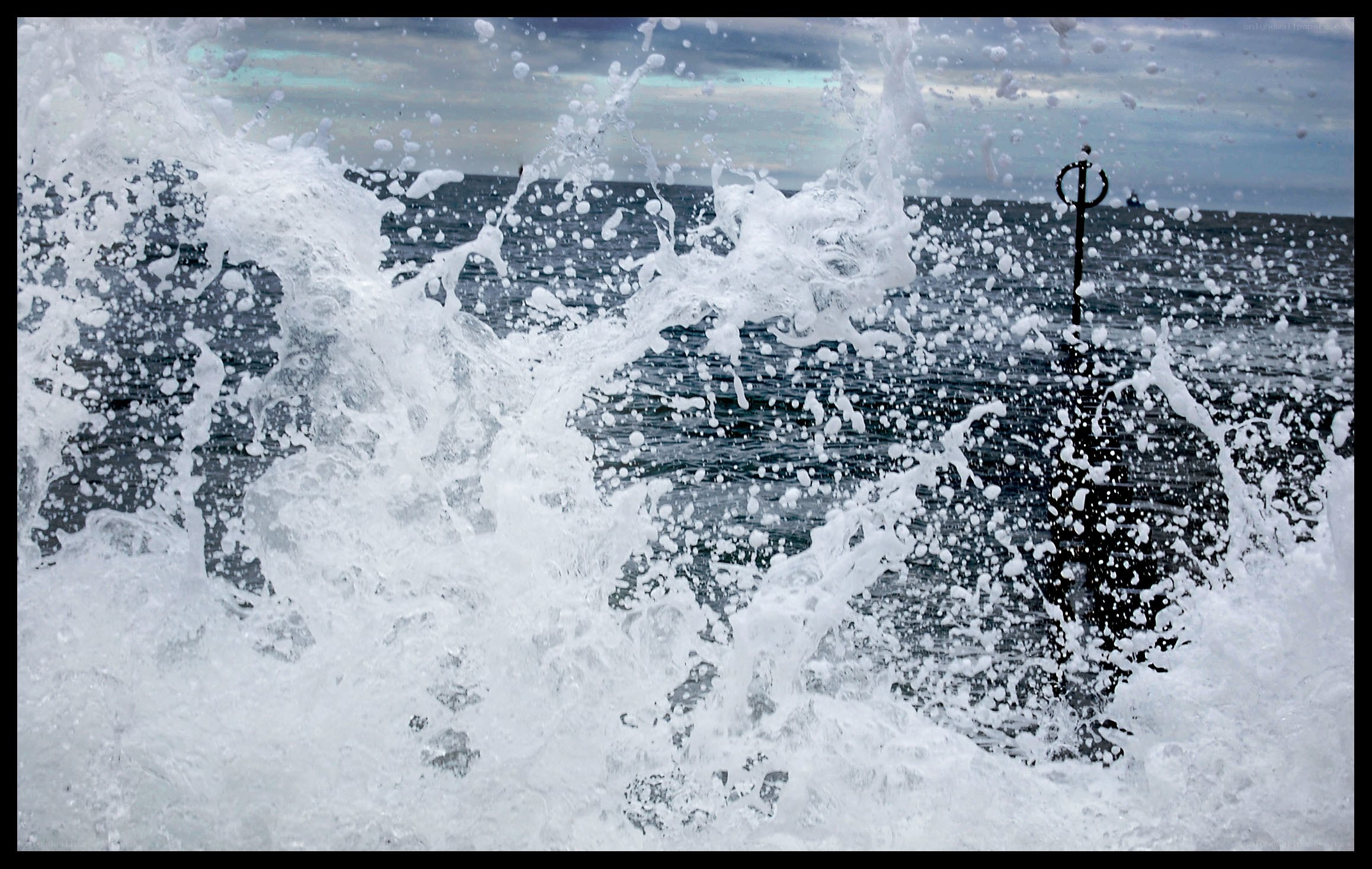Waves crashing on a pier