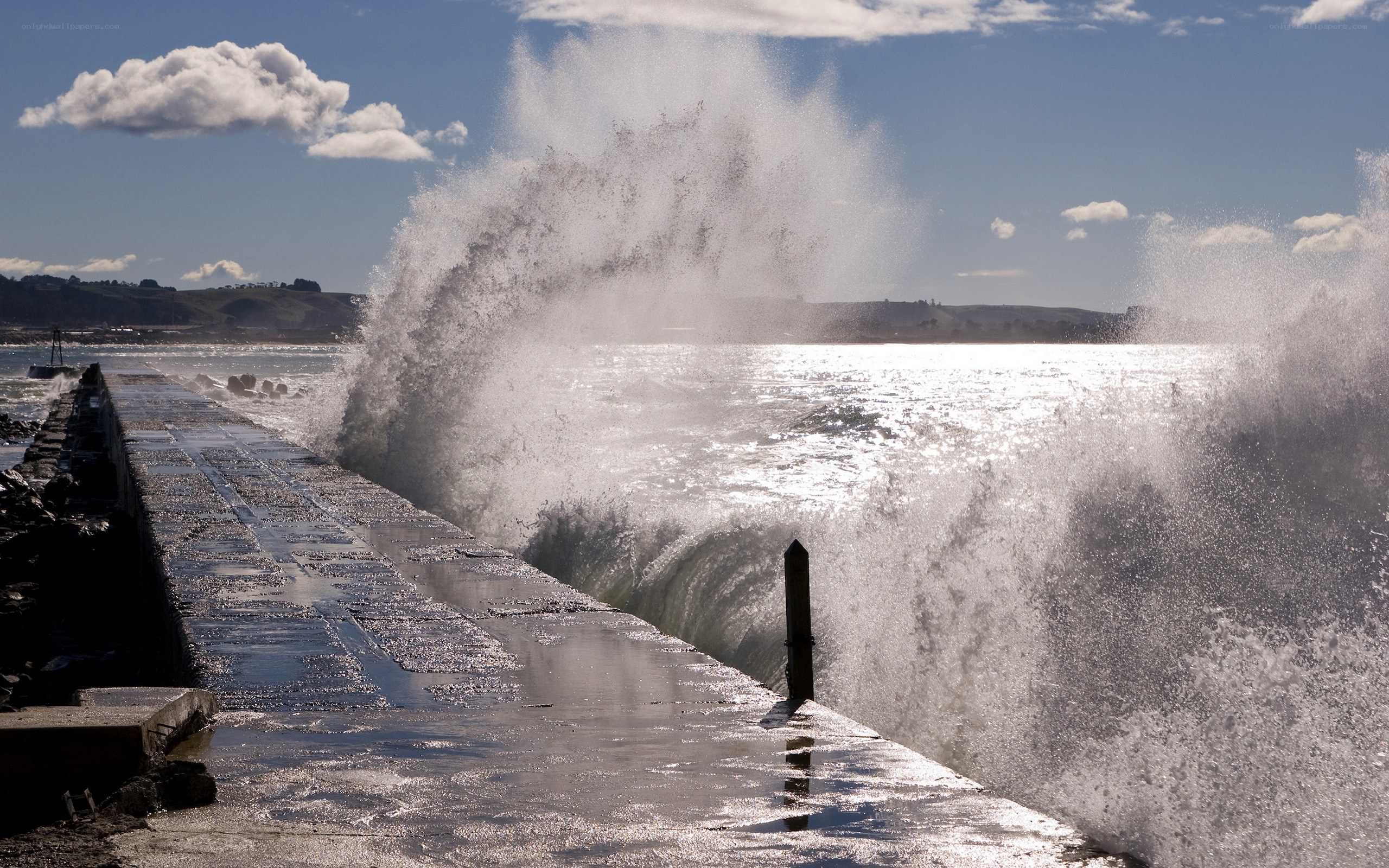 Waves crashing on a pier