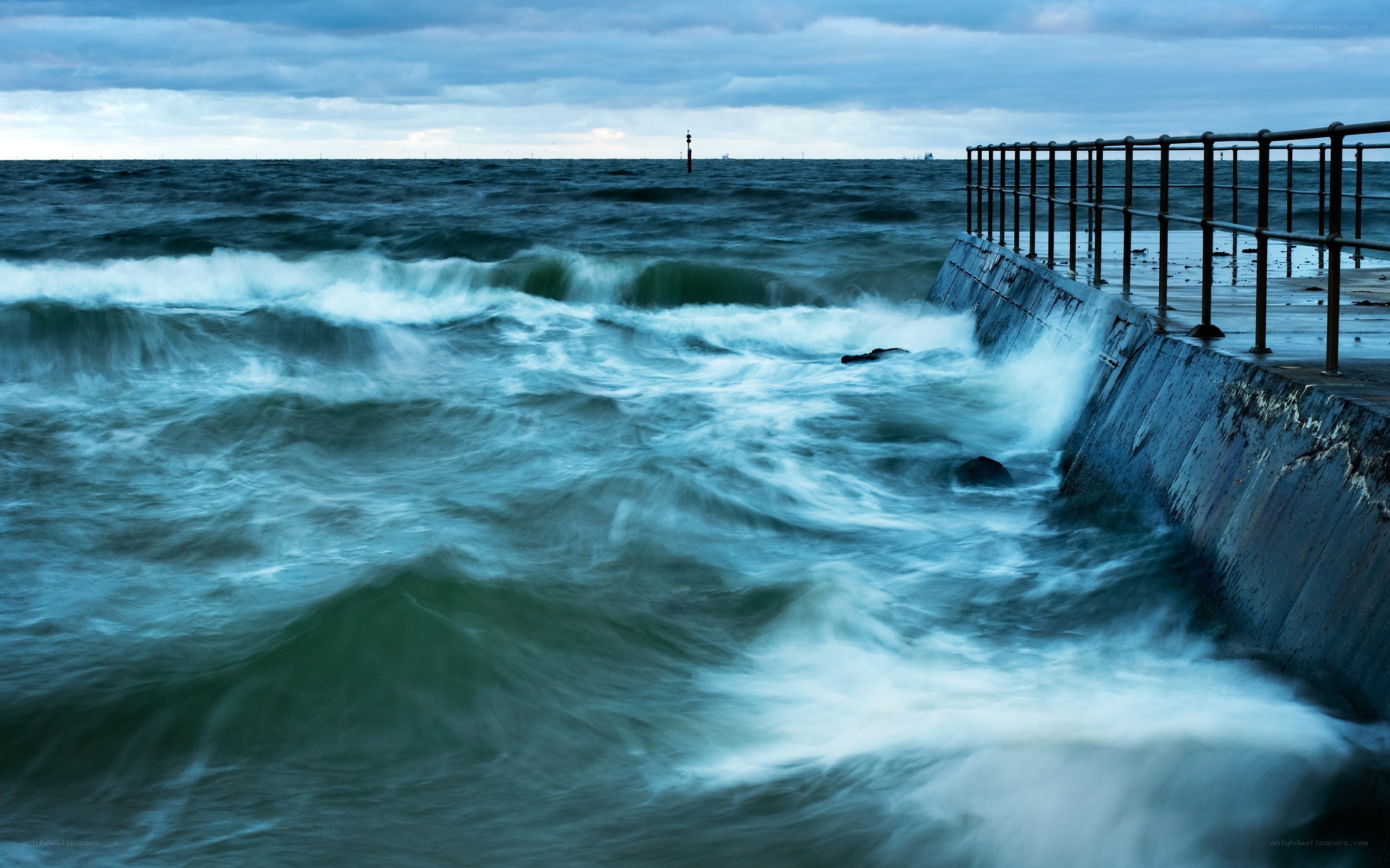 Waves crashing on a pier