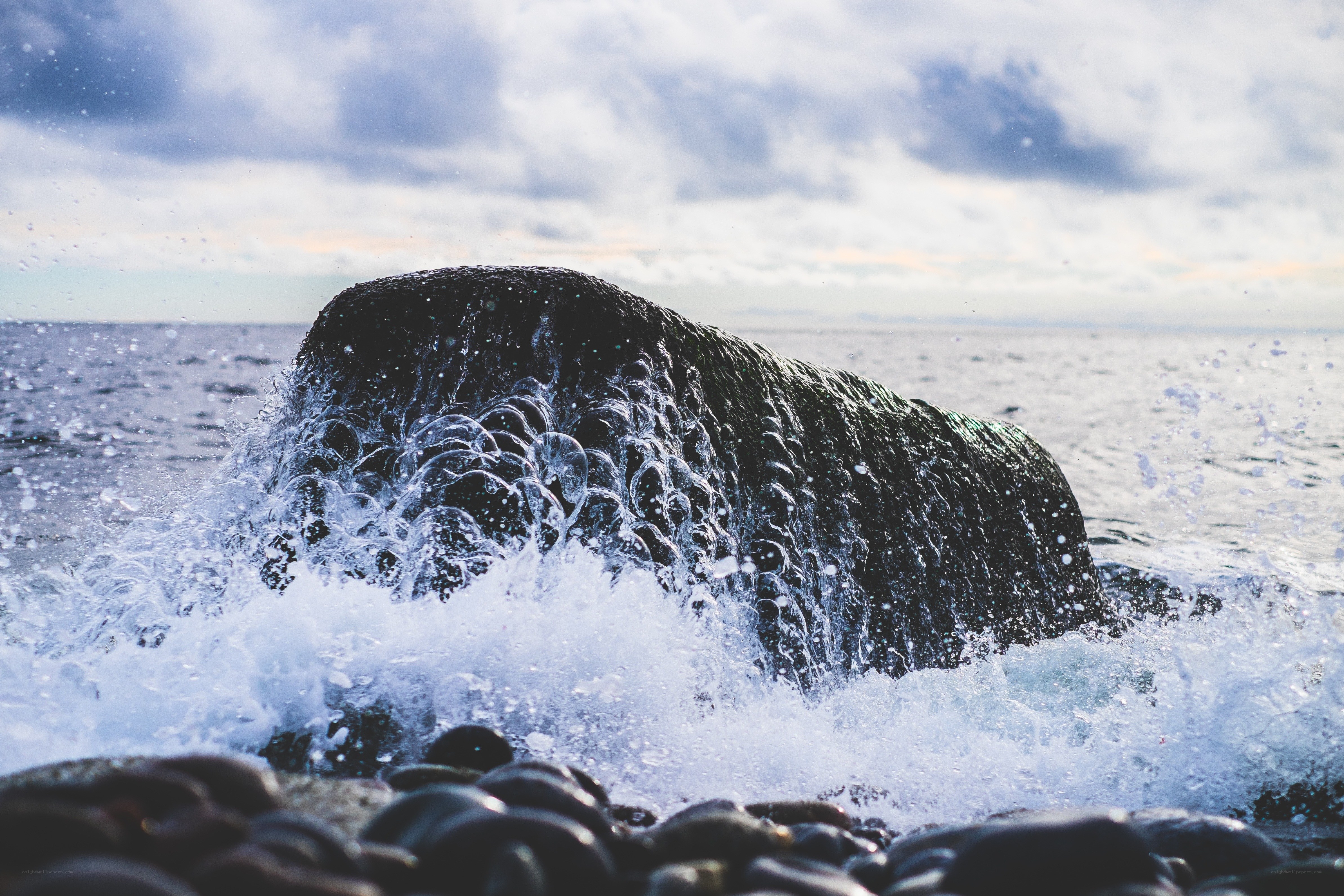 Waves crashing on a rock