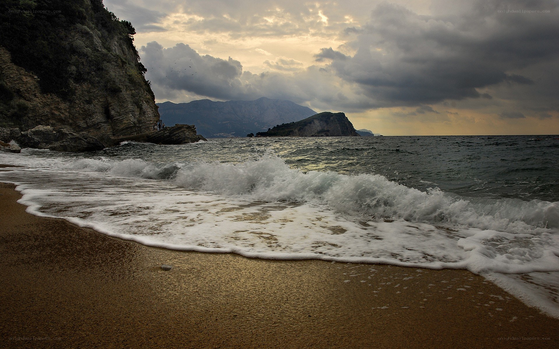 Waves crashing on a sandy beach