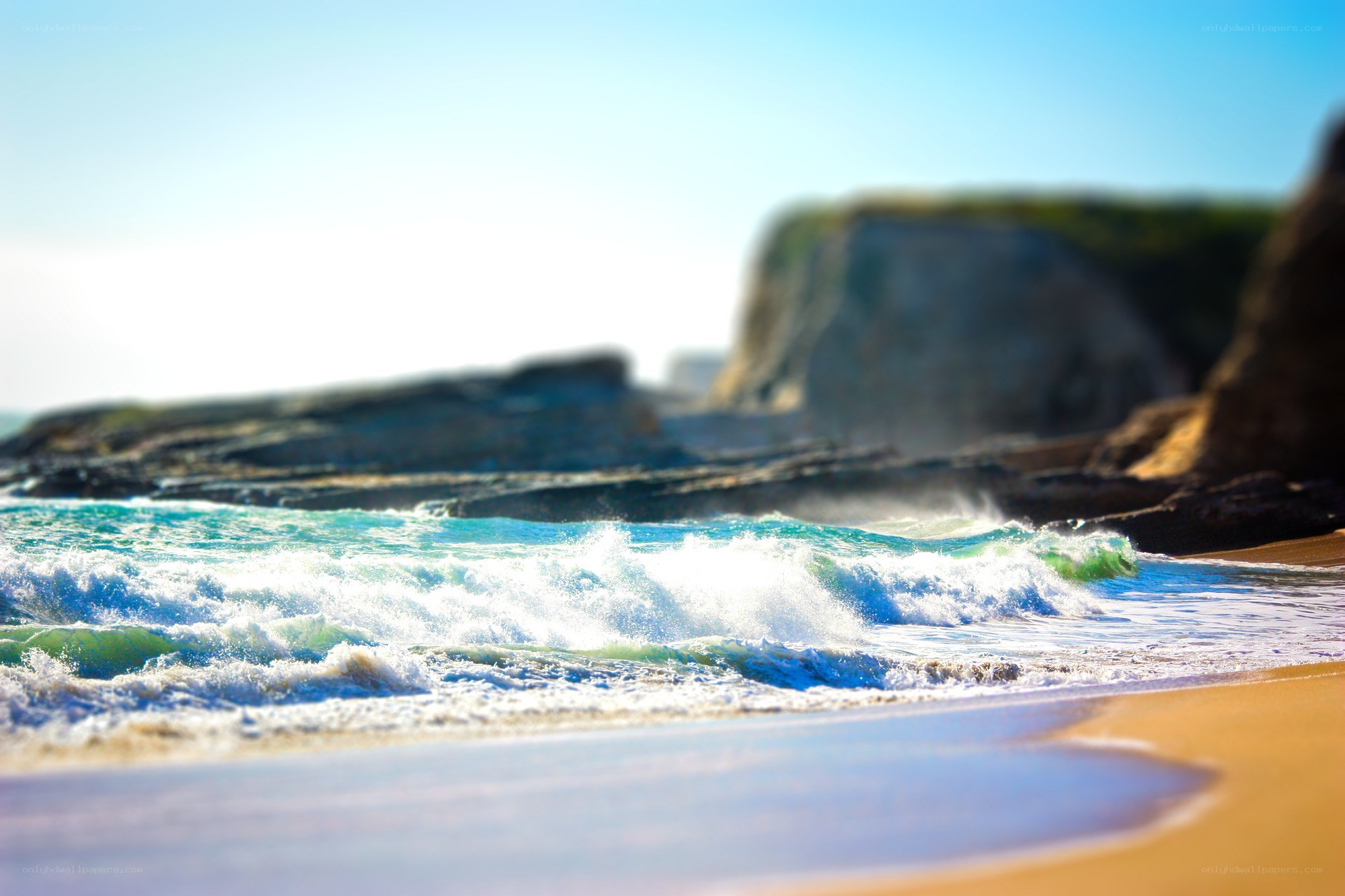 Waves crashing on a sandy beach