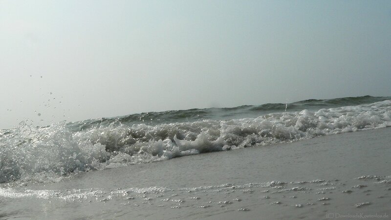 Waves crashing on a sandy beach