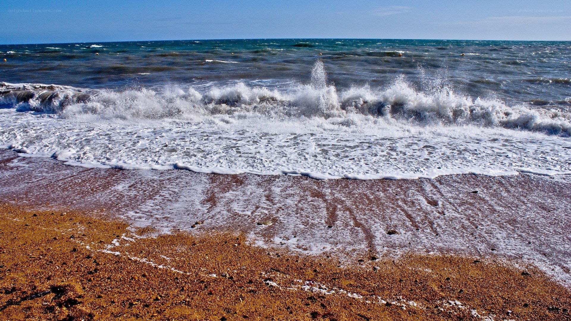 Waves crashing on a sandy beach