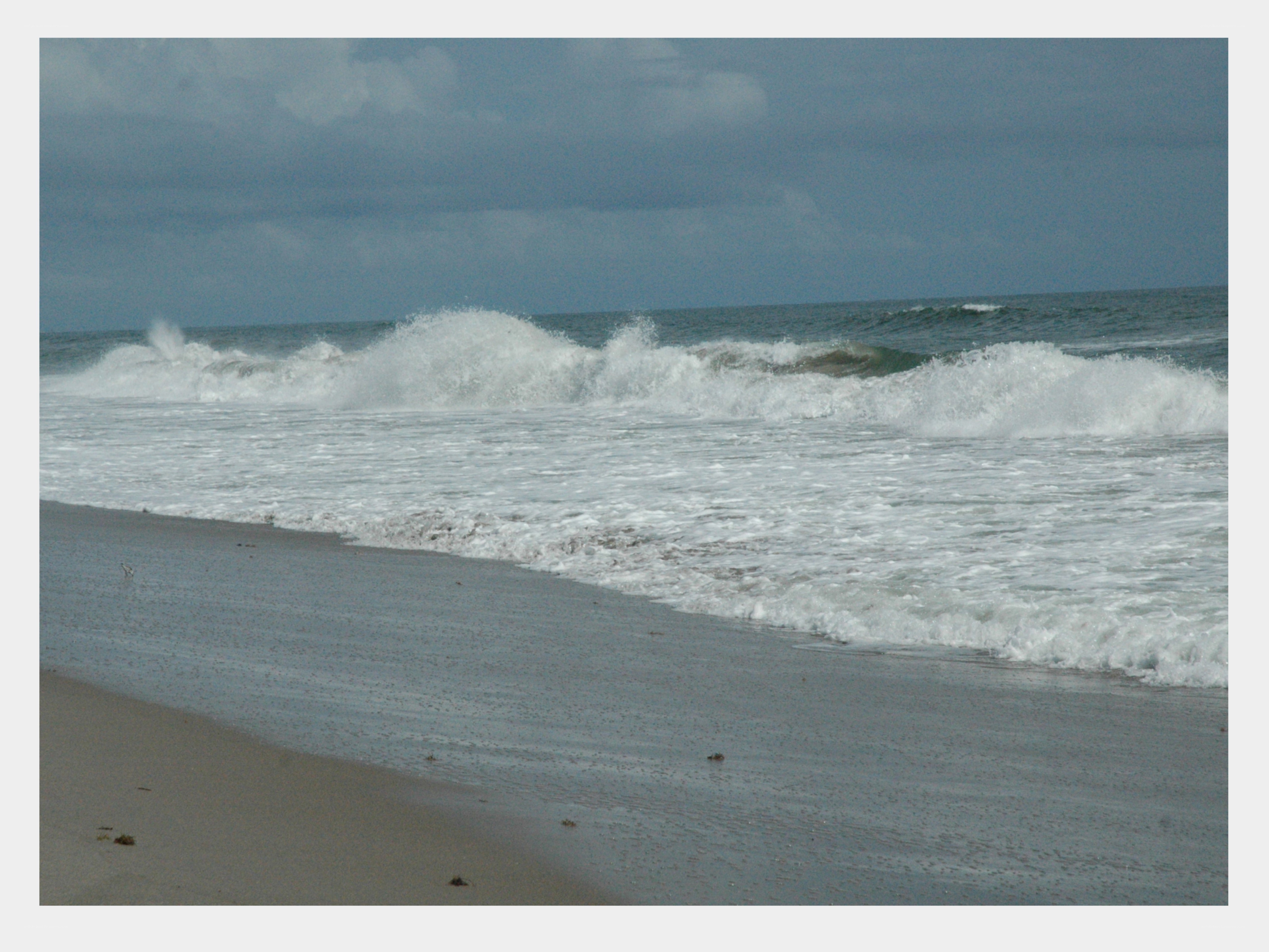 Waves crashing on a sandy beach