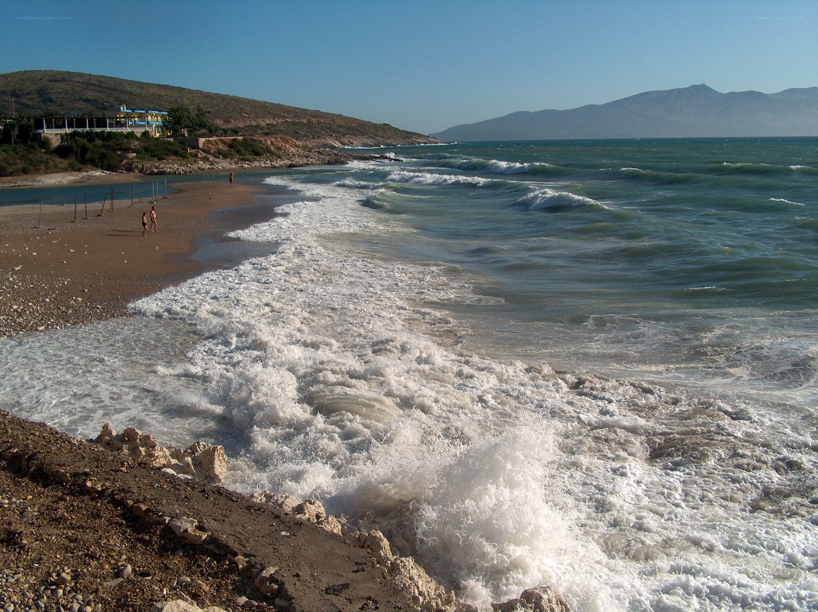 Waves crashing on a sandy beach