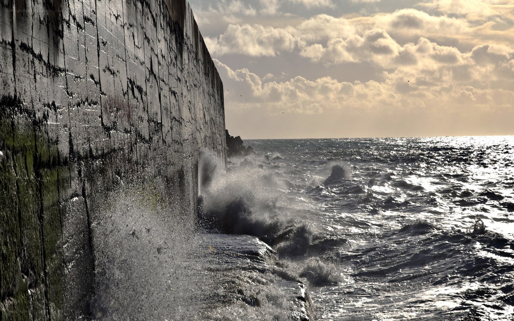 Waves crashing on a sea wall