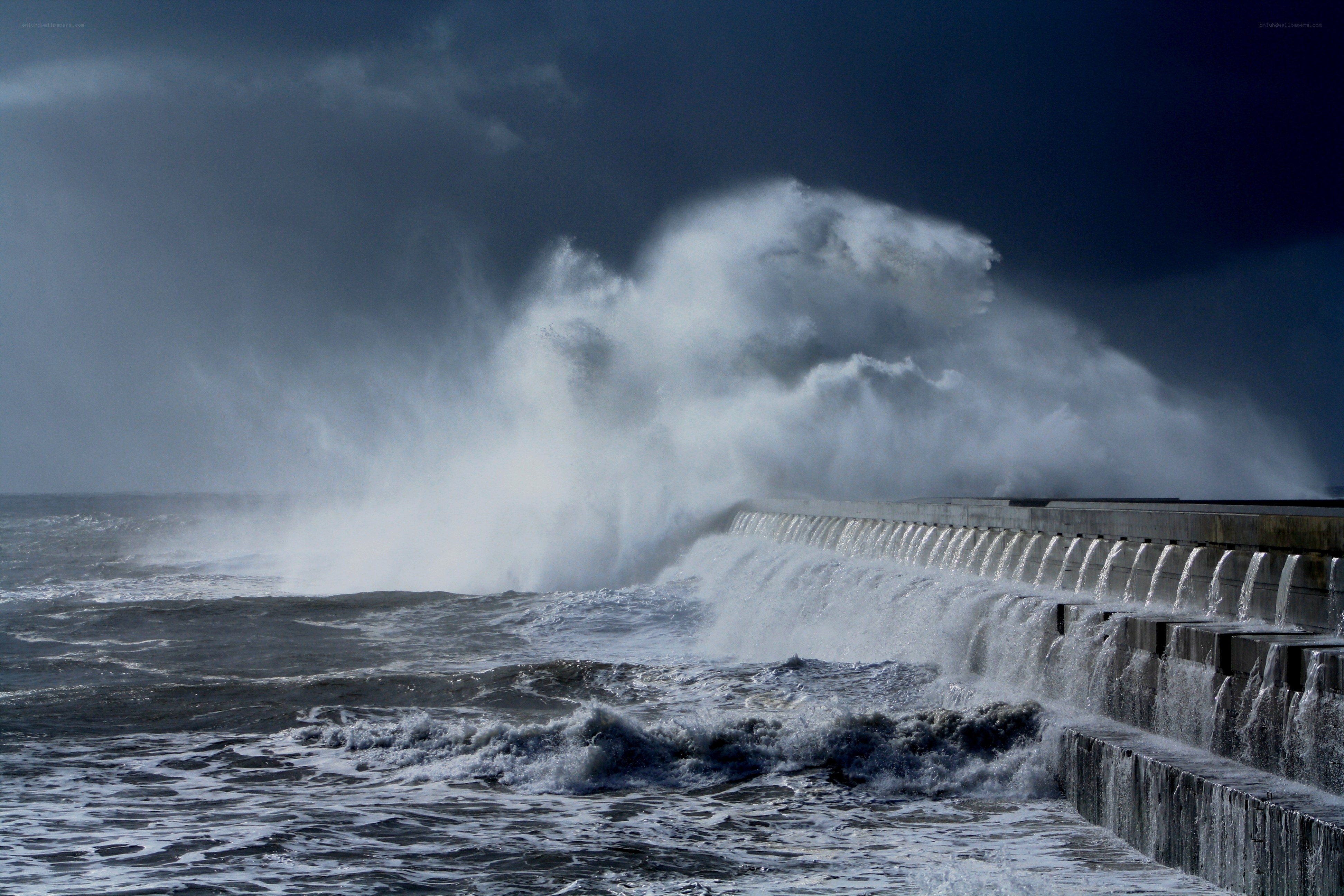 Waves crashing on a seawall