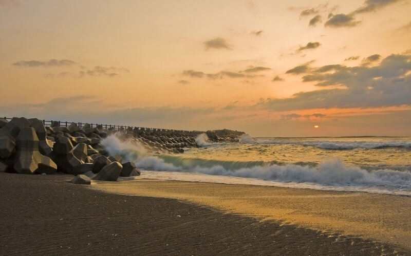 Waves Crashing on Breakwater — Orange