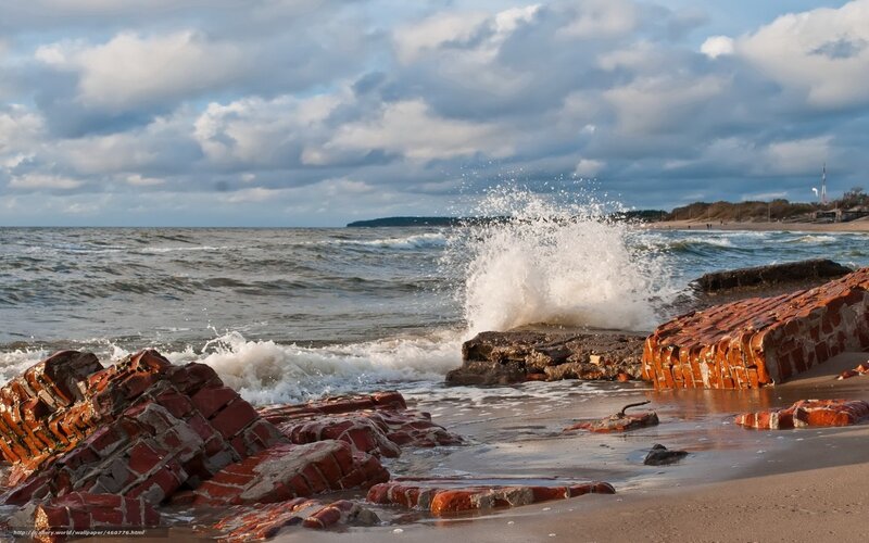 Waves crashing on brick ruins