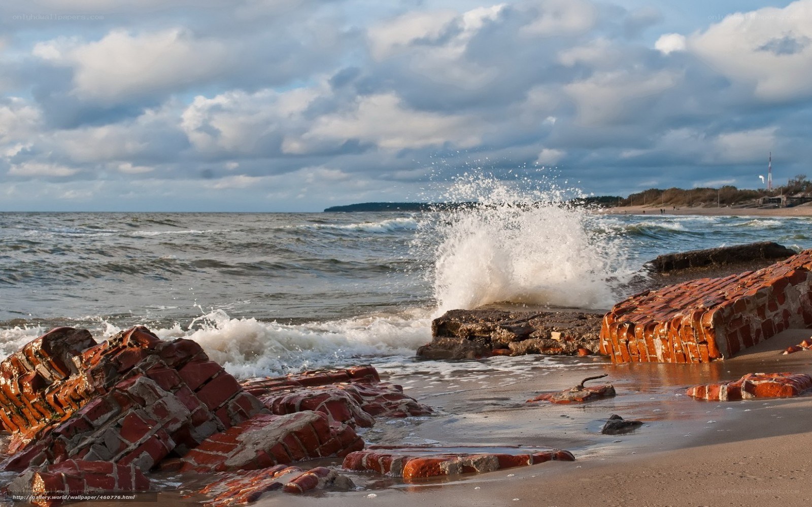 Waves crashing on brick ruins