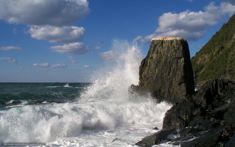 Waves crashing on coastal rock