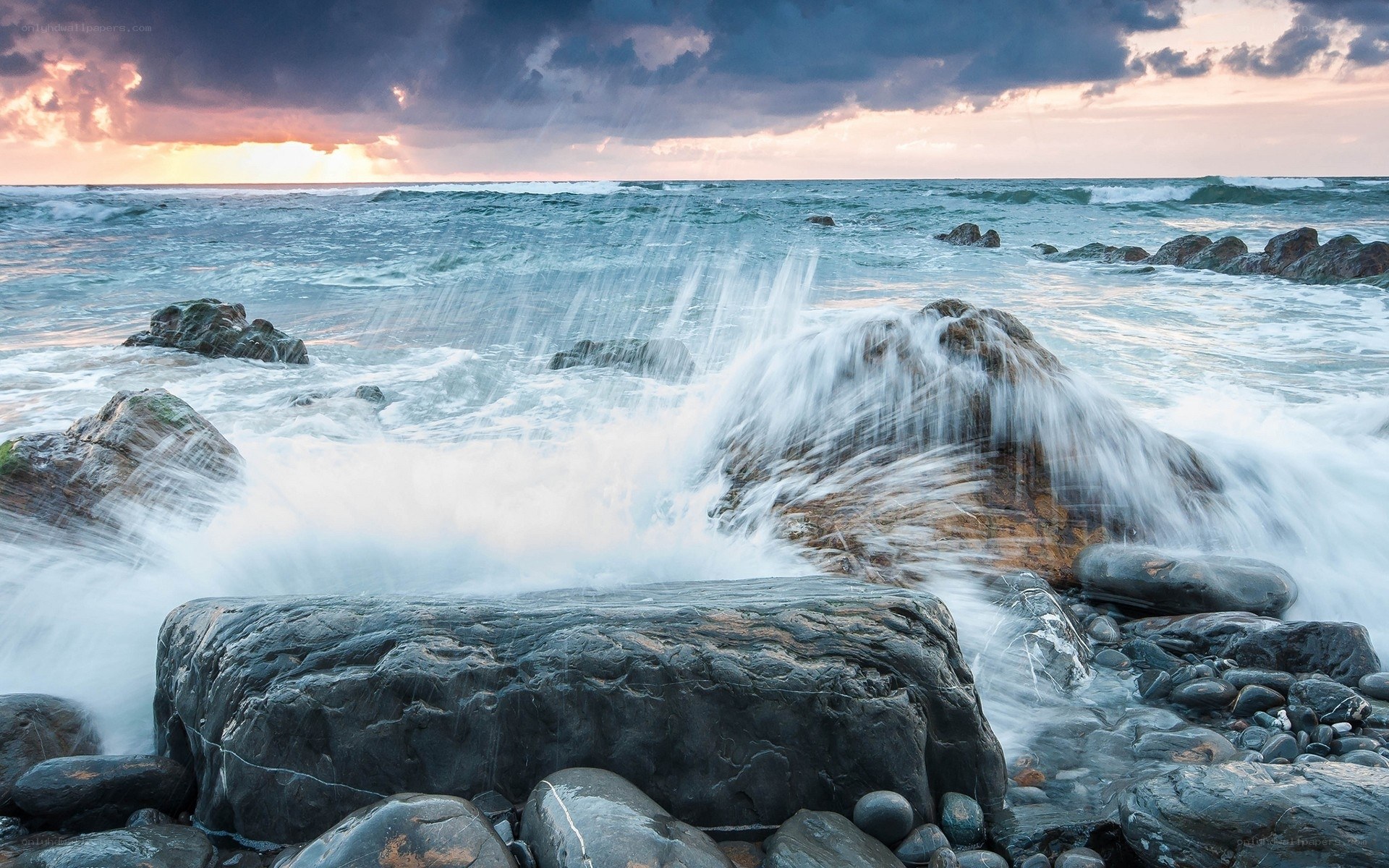 Waves crashing on coastal rocks