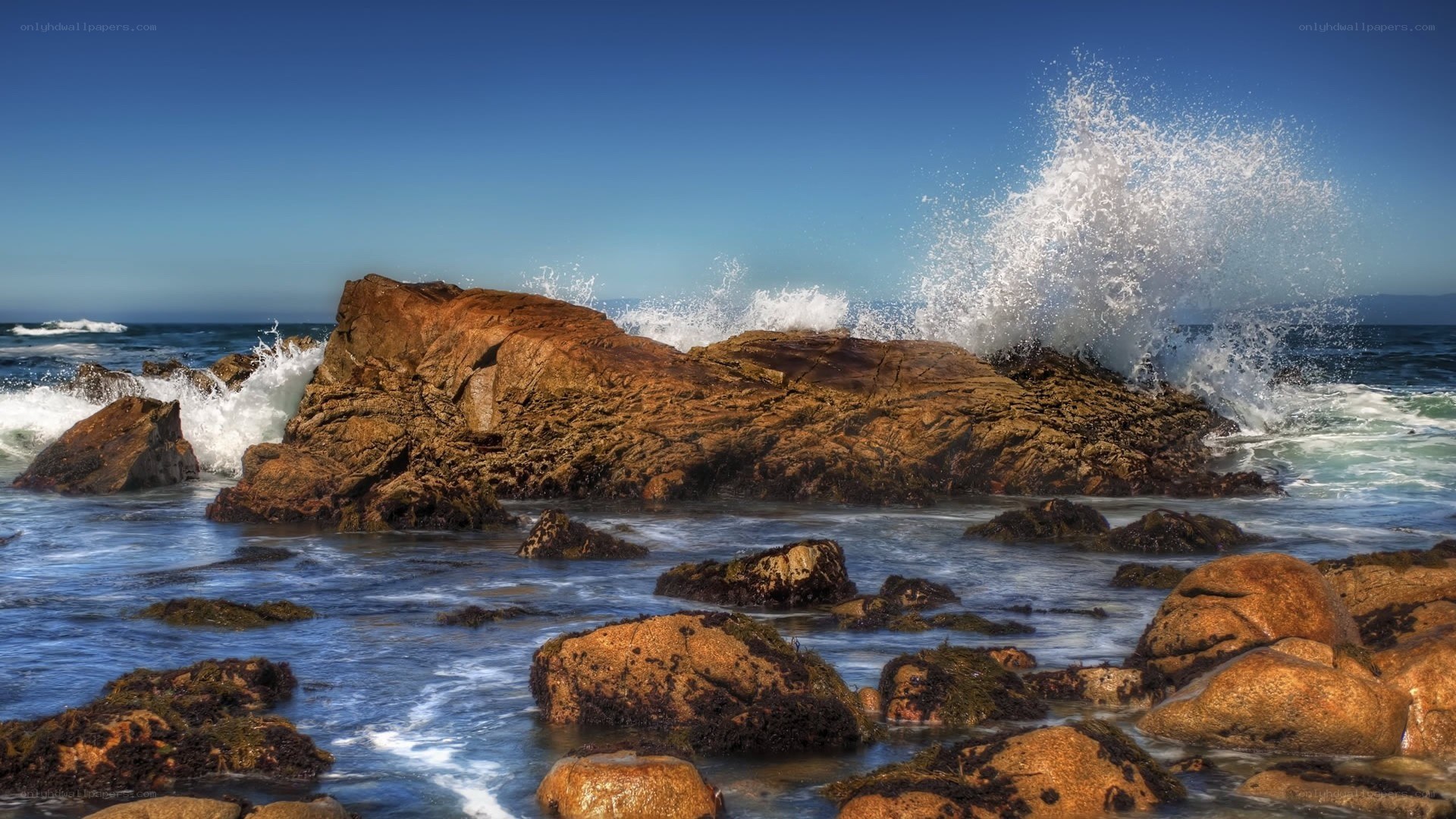 Waves crashing on coastal rocks