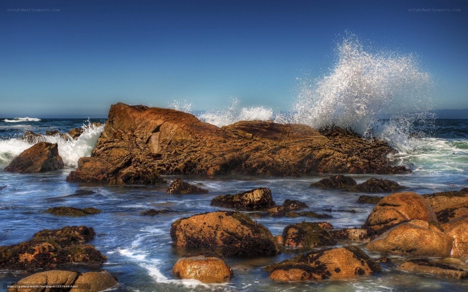 Waves crashing on coastal rocks