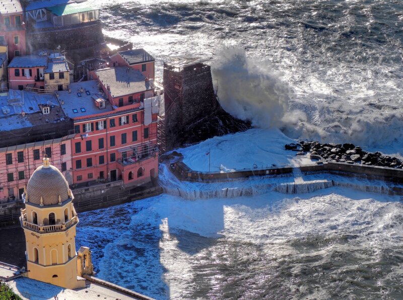 Waves Crashing on Coastal Town — Blue
