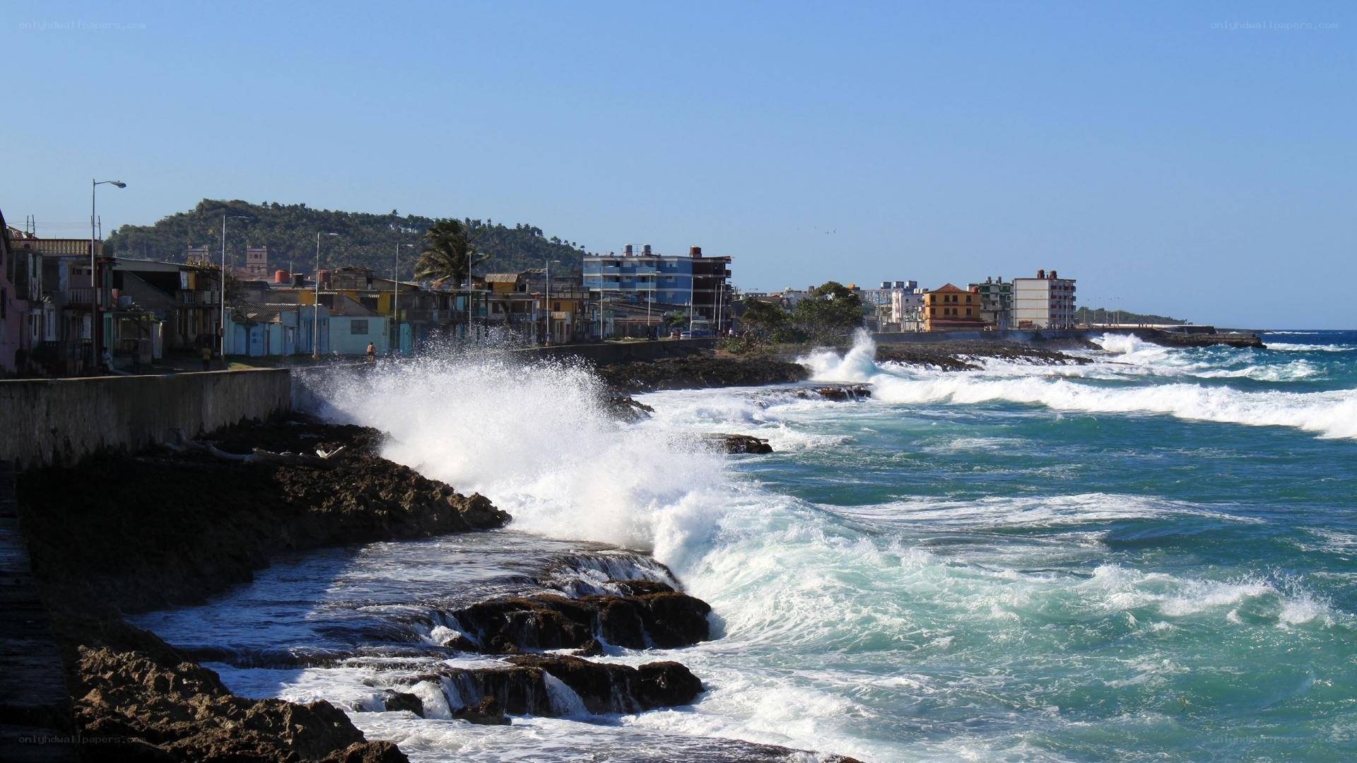 Waves crashing on coastal town