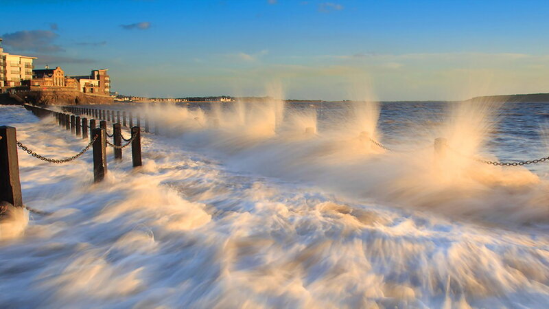 Waves Crashing on Pier — Blue, Dramatic, Sunset, Photograph, Buildings