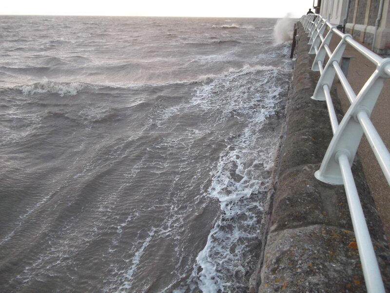Waves Crashing on Pier — Gray, Dramatic, Sunset