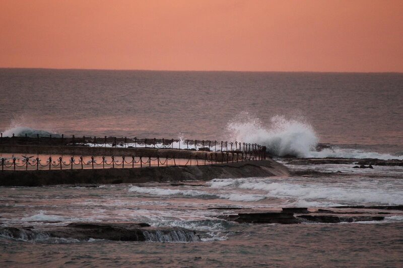 Waves Crashing on Pier — Orange