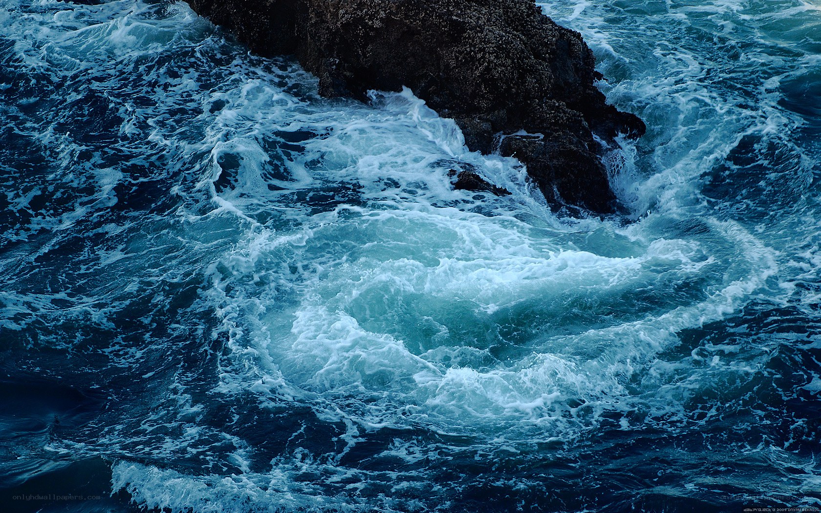 Waves crashing on rocks