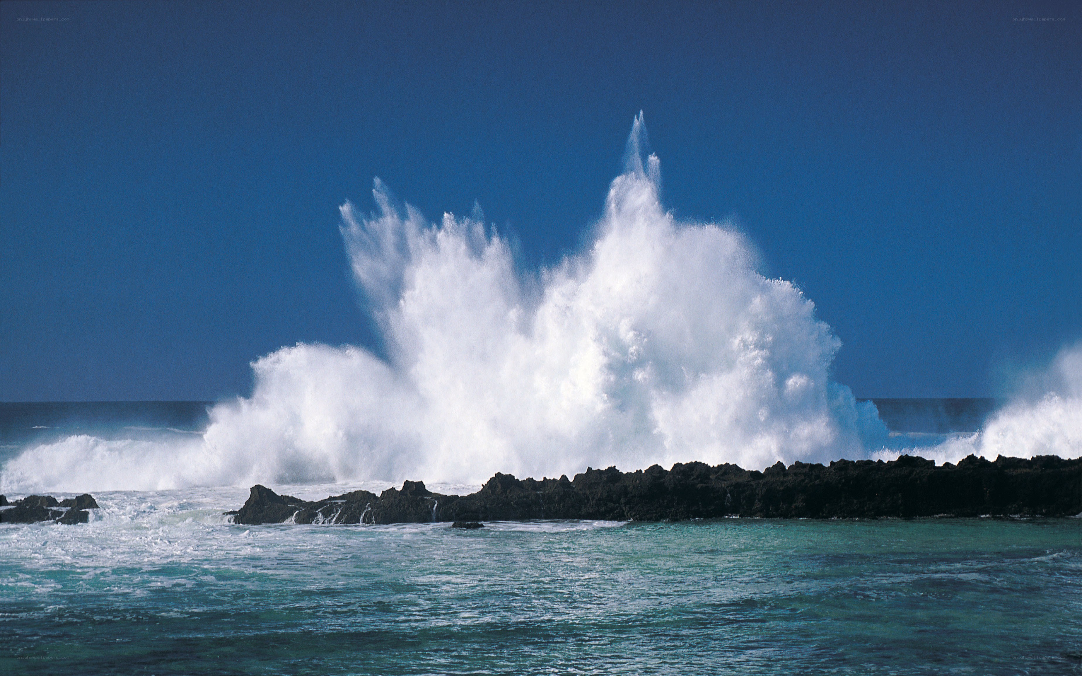 Waves crashing on rocks