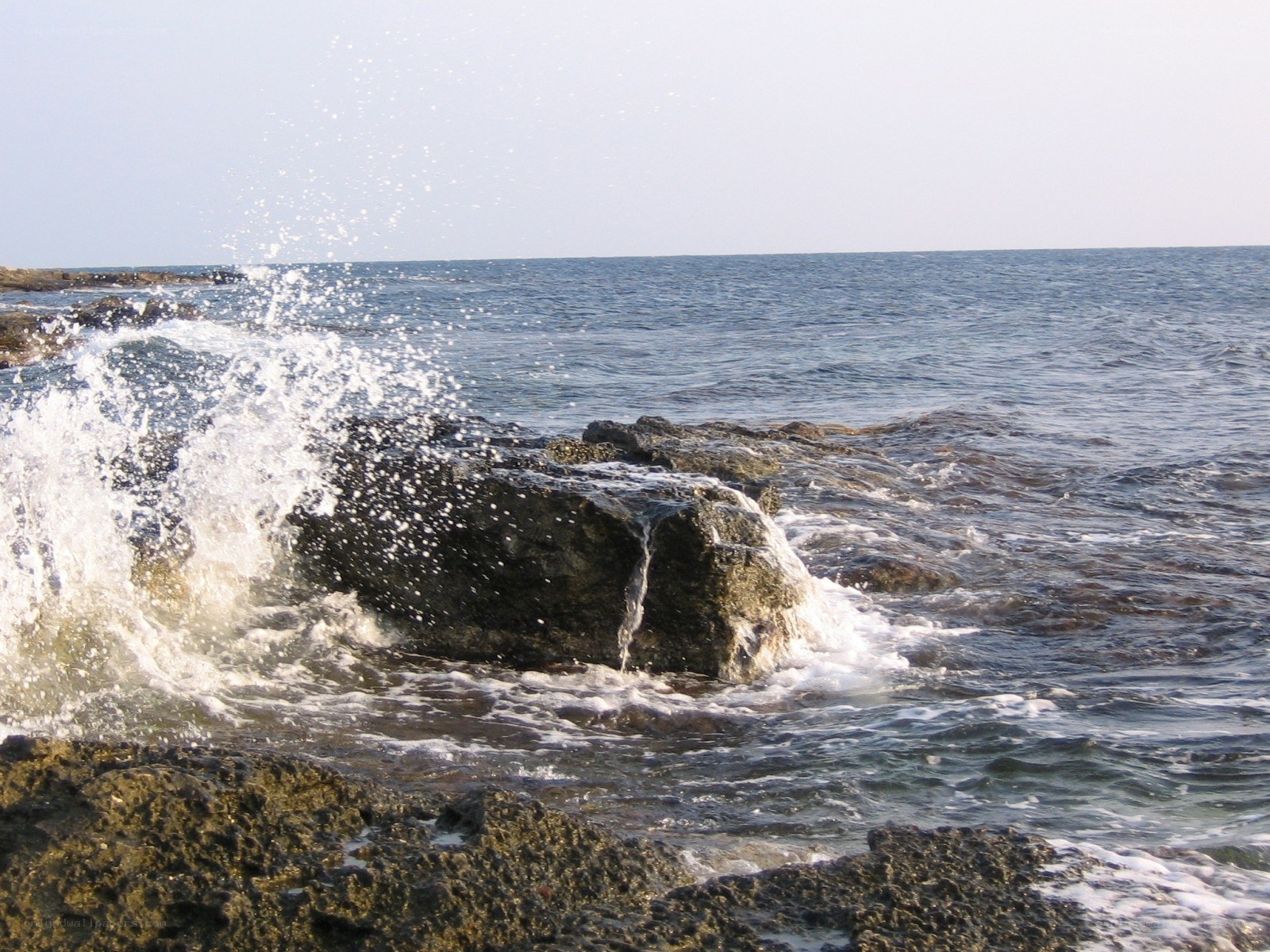 Waves crashing on rocks
