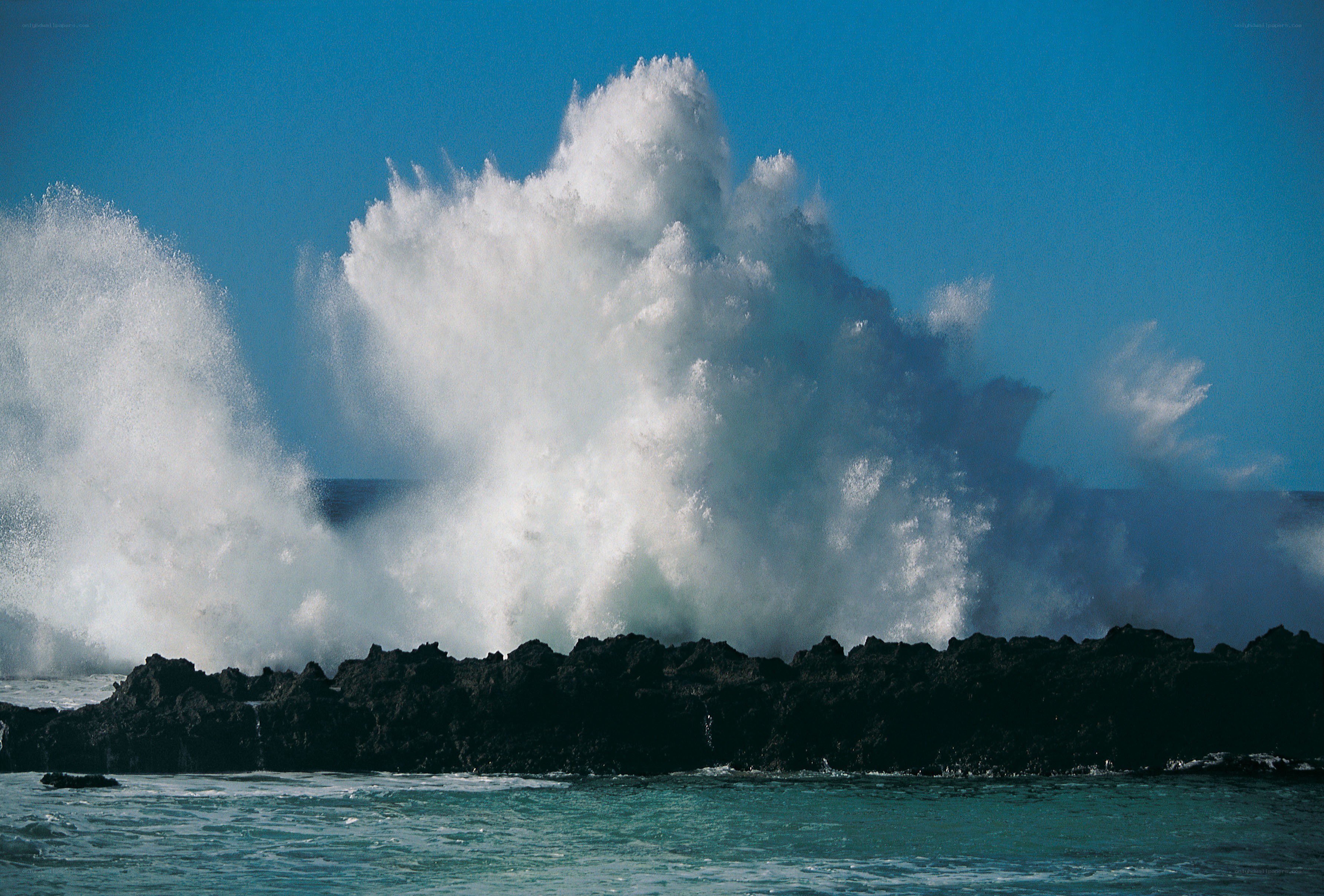Waves crashing on rocks