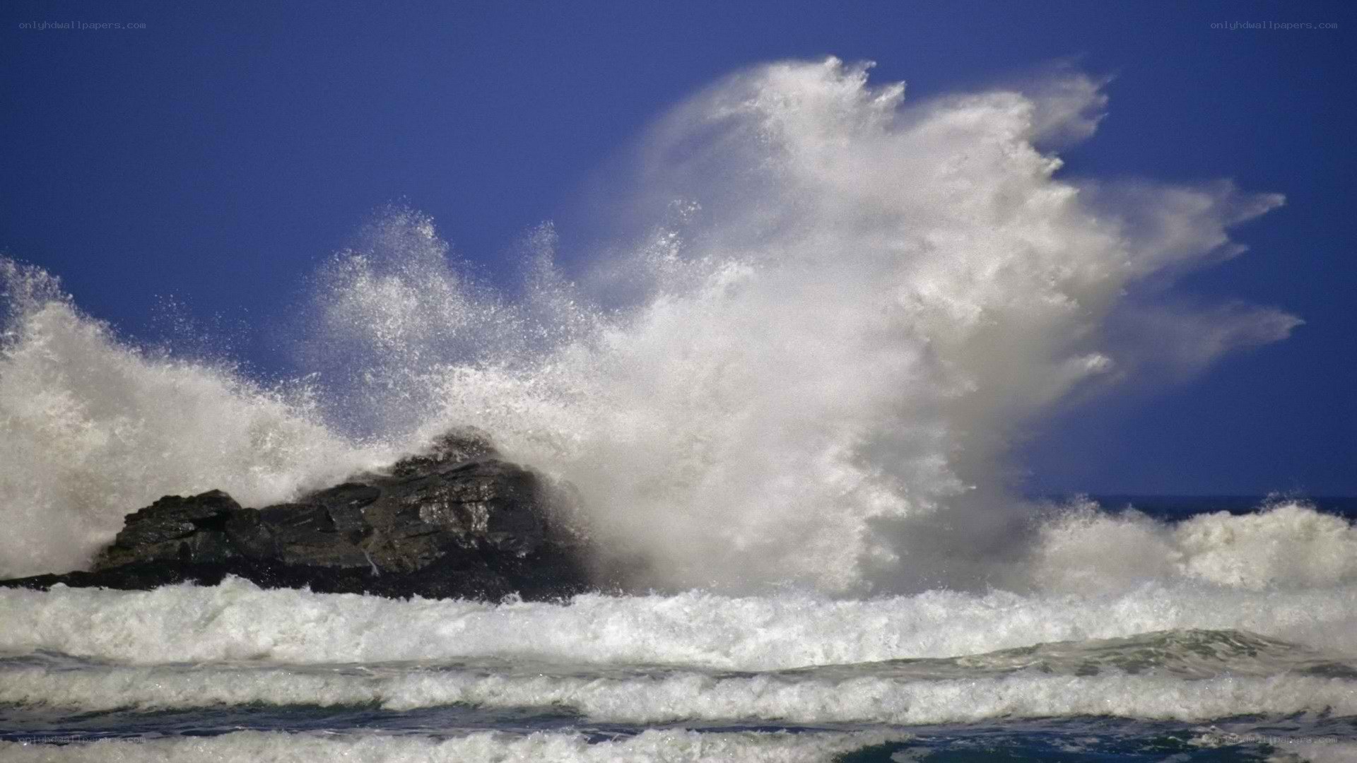 Waves crashing on rocks
