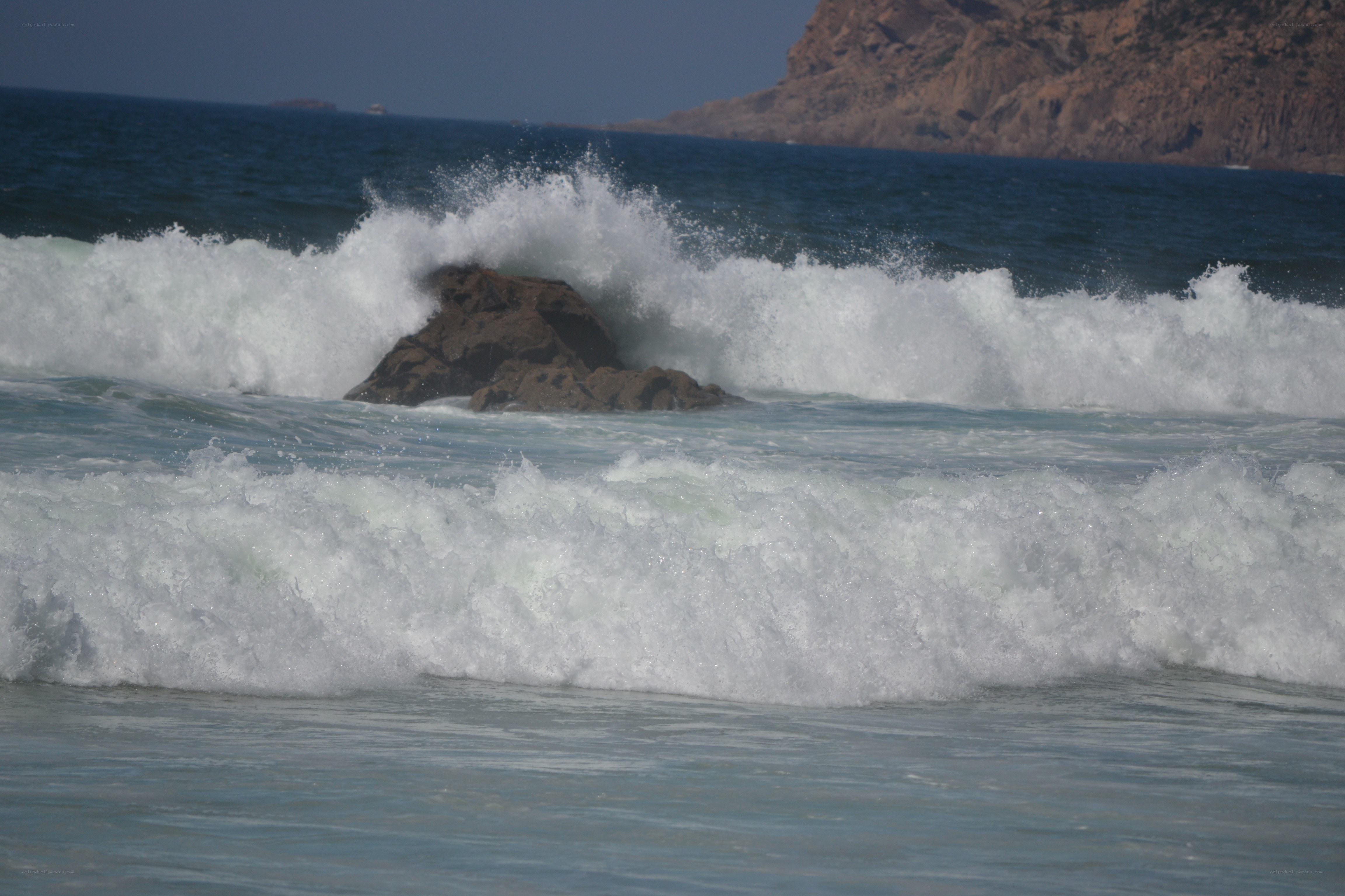 Waves crashing on rocks