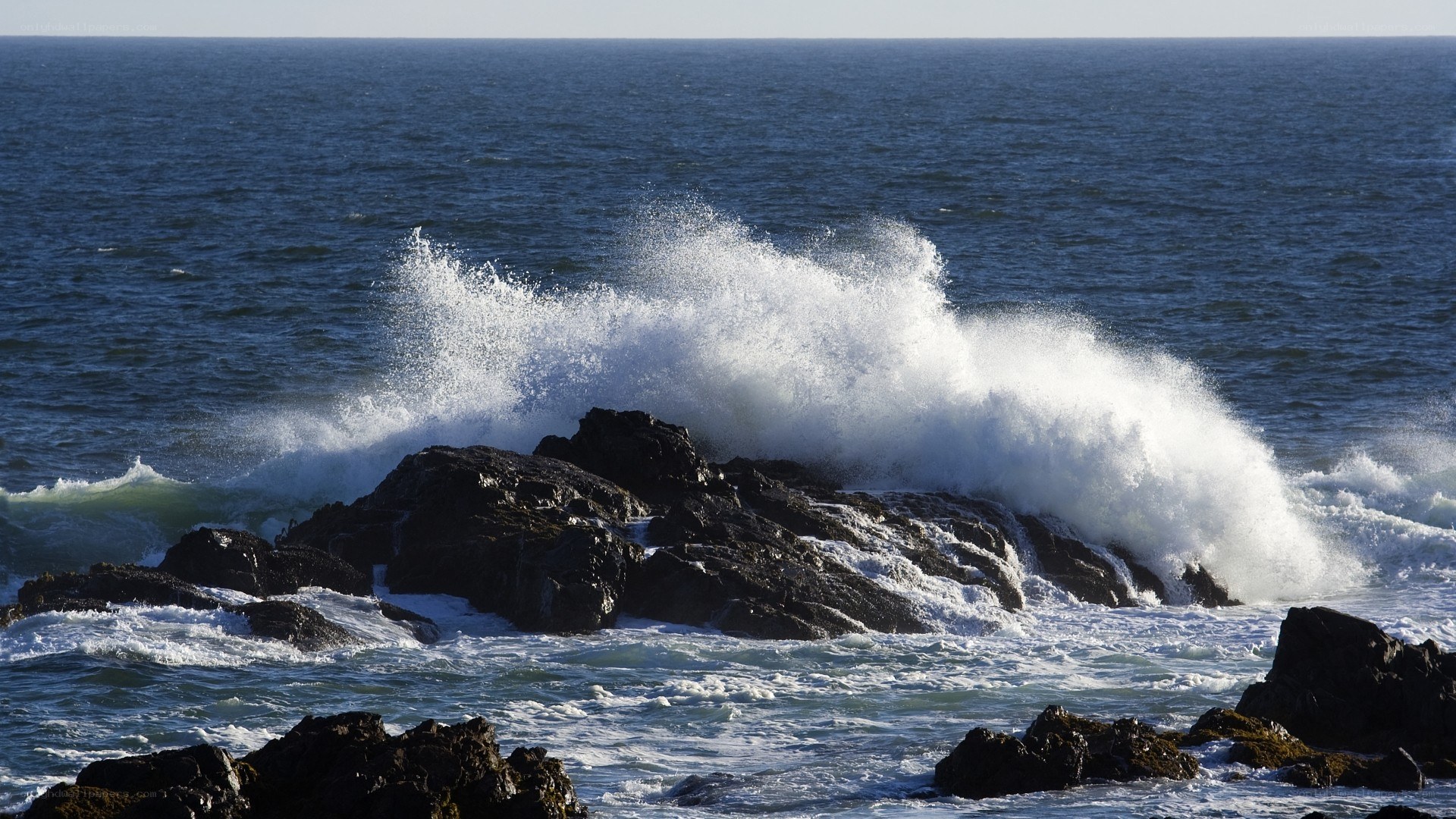 Waves crashing on rocks