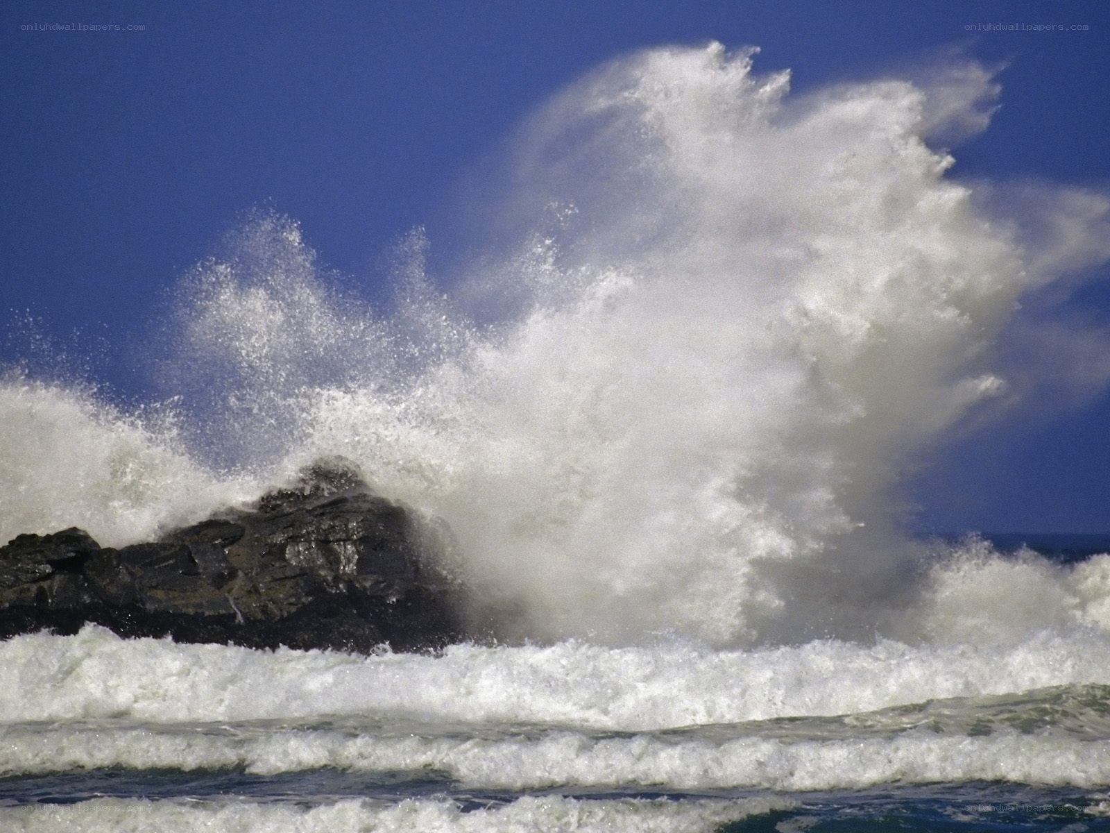 Waves crashing on rocks