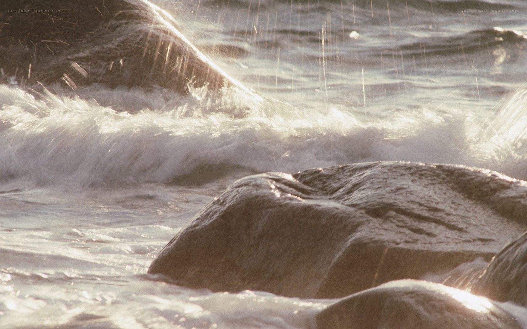 Waves crashing on rocks
