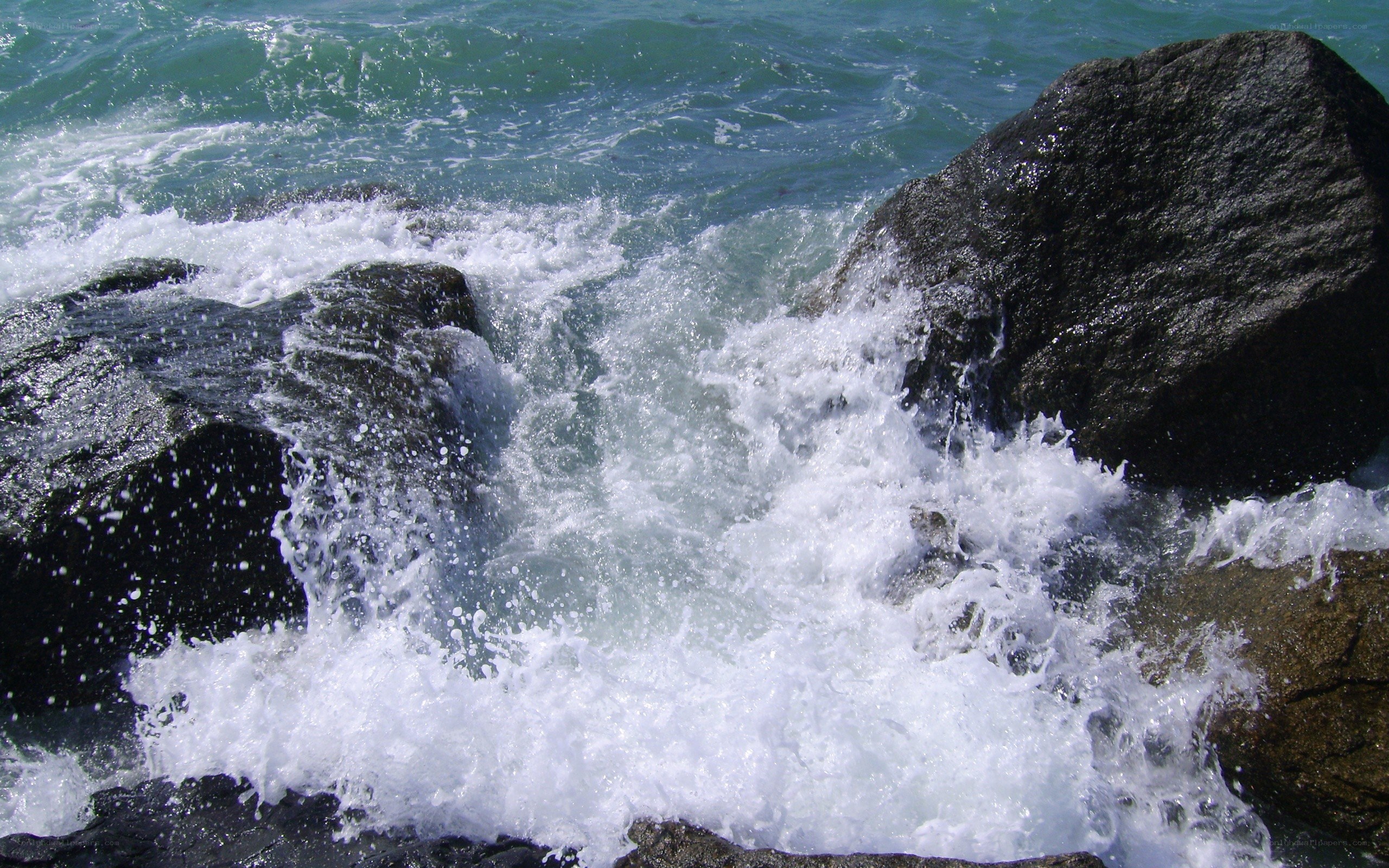 Waves crashing on rocks