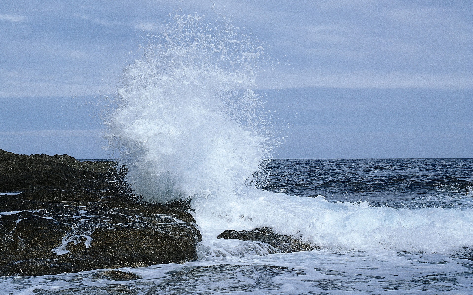 Waves crashing on rocks