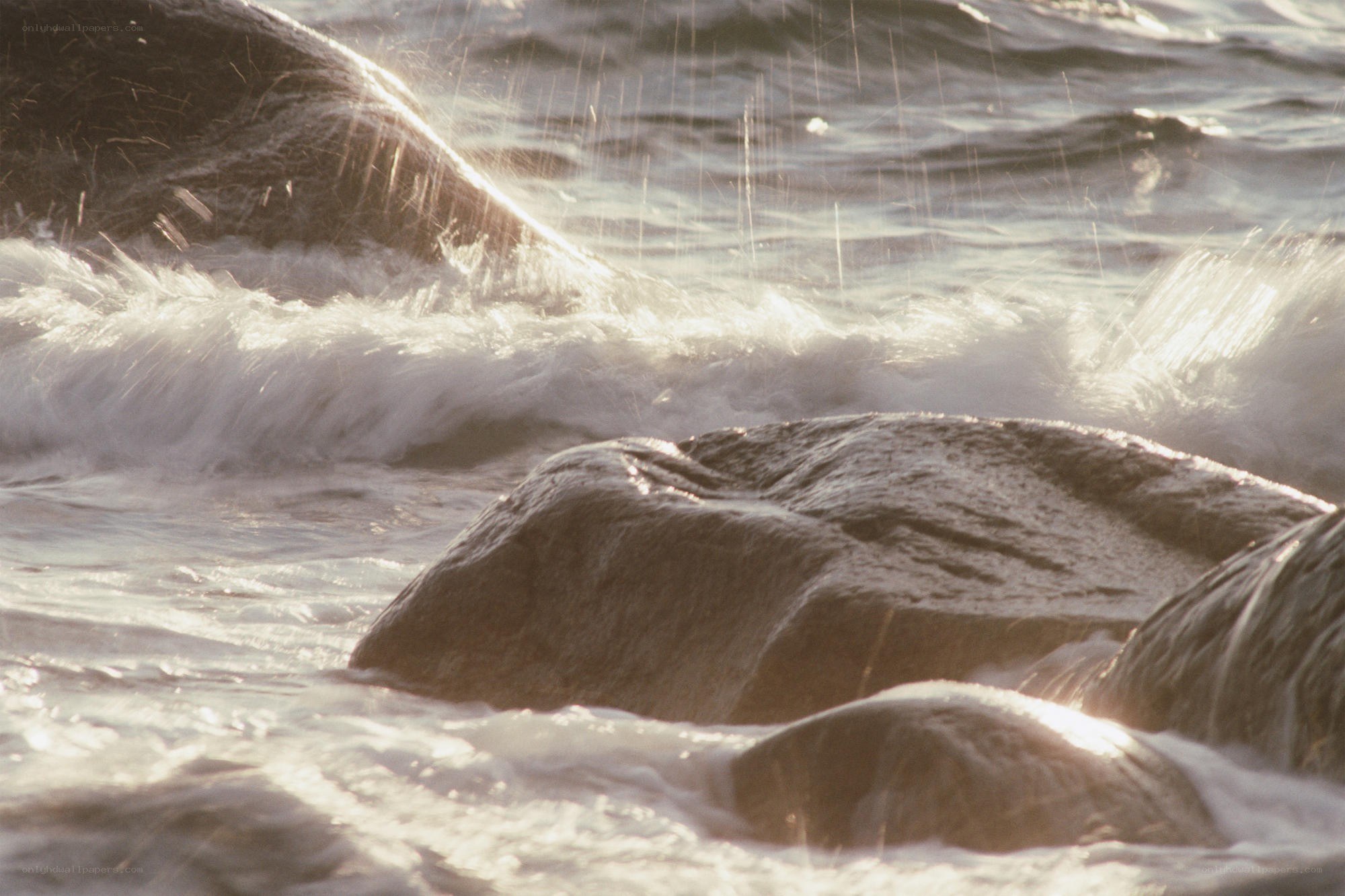 Waves crashing on rocks