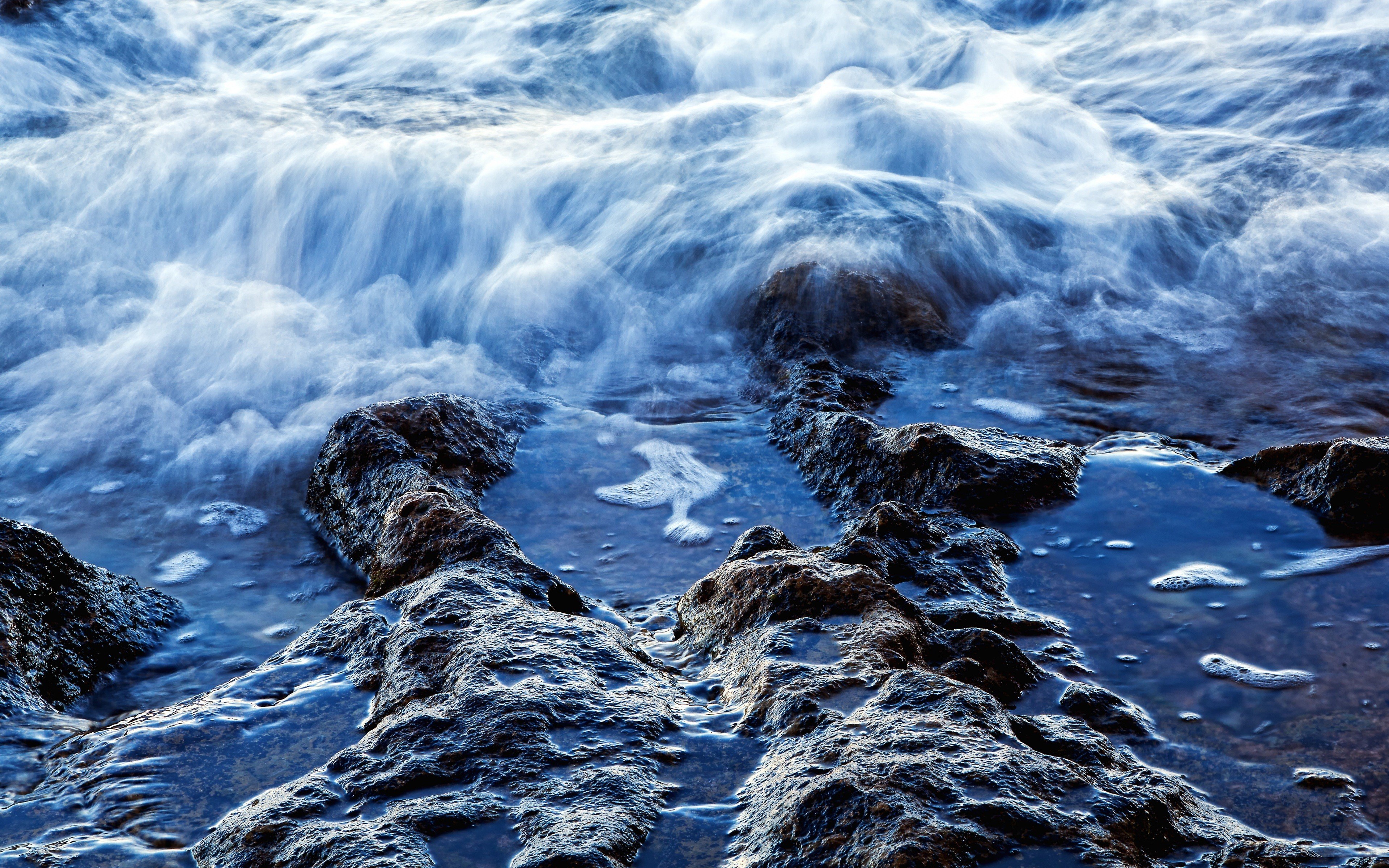 Waves crashing on rocks
